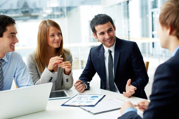Jorns & Associates team meeting with a client